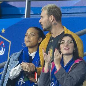 M. Pokora (Matt Pokora), sa femme Christina Milian assistent au match de la 5ème et avant-dernière journée de Ligue des nations entre la France et l'Autriche (2-0) au Stade de France à Saint-Denis le 22 septembre 2022.