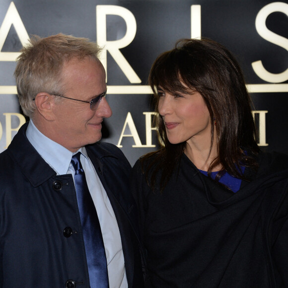 Sophie Marceau et son compagnon Christophe Lambert - Défilé Giorgio Armani Haute Couture Printemps/Ete 2014 au Palais de Tokyo à Paris, le 21 janvier 2014.