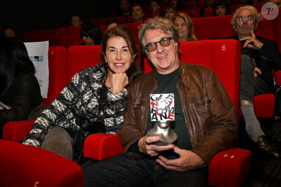 François Cluzet et sa femme Narjiss Slaoui-Falcoz durant la soirée de clôture et remise des prix de la 4eme édition du Nice Festival CinéRoman au cinéma Pathé Gare du Sud à Nice, le 9 octobre 2022.