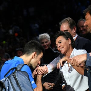 Novak Djokovic " Nole", Henri Leconte et sa compagne Maria Dowlatshahi - Novak Djokovic " Nole", remporte son match face à Maxime Cressy lors du tournoi de tennis "Rolex Paris Masters 2022" à Bercy AccorHotels Arena à Paris, le1er novembre 2022 © Veeren/Bestimage 