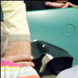 Caroline Tresca et Philippe Caroit dans les tribunes de Roland-Garros. 2004.