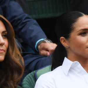 Archives - Catherine (Kate) Middleton, duchesse de Cambridge, Meghan Markle, duchesse de Sussex, sont dans les tribunes lors de la finale femme de Wimbledon "Serena Williams - Simona Halep (2/6 - 2/6) à Londres le 13 juillet 2019. © Chryslène Caillaud / Panoramic / Bestimage 