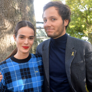 Vianney Bureau (Vianney), sa compagne Catherine Robert - People au défilé Lacoste Collection Prêt-à-Porter Printemps/Eté lors de la Fashion Week de Paris. © Veeren Ramsamy-Christophe Clovis/Bestimage 