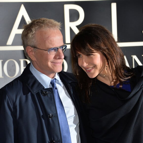 Sophie Marceau et son compagnon Christophe Lambert - Arrivee des people au defile Giorgio Armani Haute Couture Printemps/Ete 2014 au Palais de Tokyo a Paris, le 21 janvier 2014. 