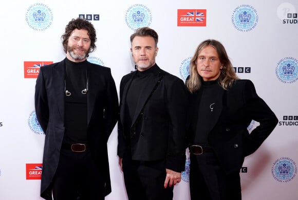 Les membres du groupe Take That, Howard Donald, Gary Barlow et Mark Owen en backstage du concert du couronnement dans l'enceinte du château de Windsor, le 7 mai 2023.
