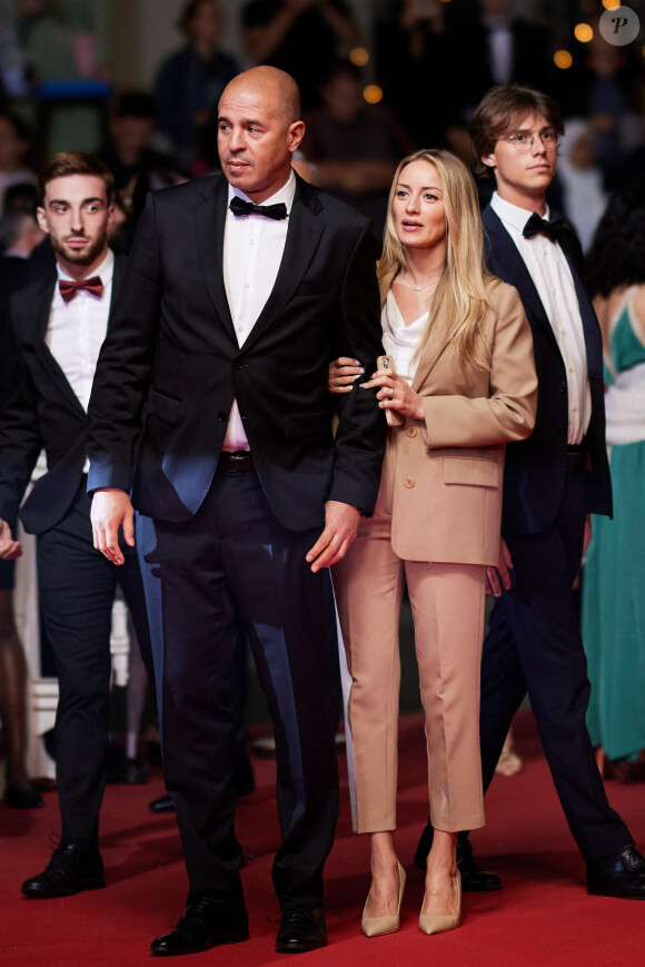 Cut Killer et sa compagne Lily - Montée des marches du film " Acide " lors du 76ème Festival International du Film de Cannes, au Palais des Festivals à Cannes. Le 21 mai 2023 © Jacovides-Moreau / Bestimage 