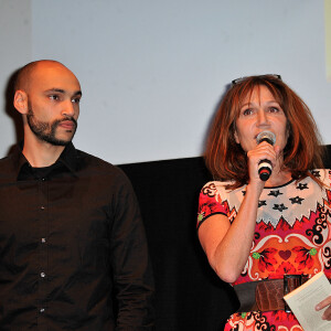 Clementine Celarie avec son fils Abraham lors du Festival Atmosphere a Courbevoie le 2 Avril 2013.