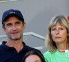 Karin Viard et son compagnon Manuel Herrero dans les tribunes des Internationaux de France de Roland Garros à Paris le 11 juin 2021. © Dominique Jacovides / Bestimage 