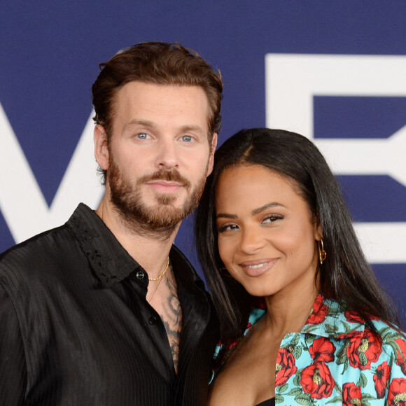 Christina Milian et son mari Matt Pokora au photocall de la première du film "Ambulance" à Los Angeles le 4 avril 2022. 