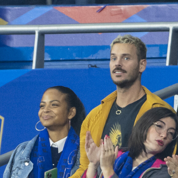 M. Pokora (Matt Pokora), sa femme Christina Milian assistent au match de la 5ème et avant-dernière journée de Ligue des nations entre la France et l'Autriche (2-0) au Stade de France à Saint-Denis le 22 septembre 2022.