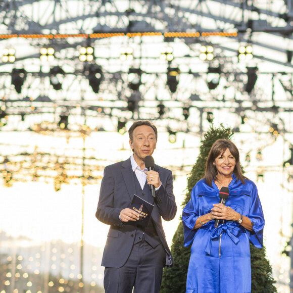 Exclusif - Stéphane Bern, Anne Hidalgo et Tony Estanguet - 10e anniversaire du "Grand Concert de Paris" au pied de la Tour Eiffel sur le Champ-de-Mars à Paris, le 14 juillet 2023. © Perusseau-Veeren/Bestimage