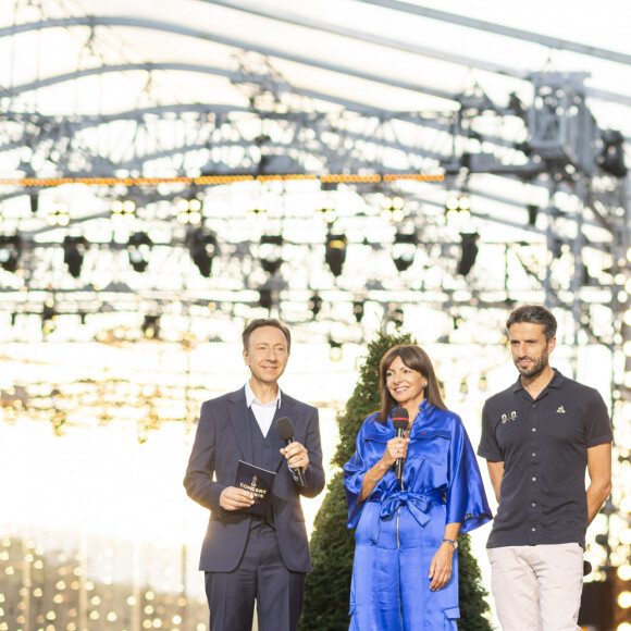 Exclusif - Stéphane Bern, Anne Hidalgo et Tony Estanguet - 10e anniversaire du "Grand Concert de Paris" au pied de la Tour Eiffel sur le Champ-de-Mars à Paris, le 14 juillet 2023. © Perusseau-Veeren/Bestimage