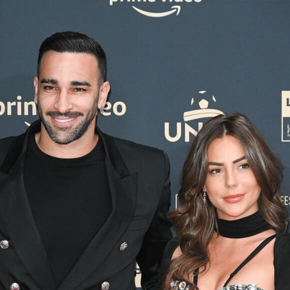 Adil Rami et sa compagne Léna Guillou - Photocall de la cérémonie des Trophées UNFP 2022 au Pavillon Gabriel à Paris le 15 mai 2022. © Coadic Guirec/Bestimage