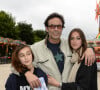 Anthony Delon avec ses filles Liv et Loup - Inauguration de la fete foraine des Tuileries a Paris le 28 juin 2013. 