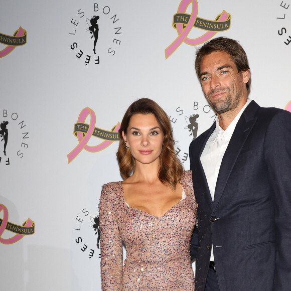Camille Lacourt et sa compagne Alice Detollenaere (Miss Bourgogne 2010) - Photocall du 4ème gala de charité de l'association "Les Bonnes Fées" à l'occasion de la campagne mondiale "Octobre Rose" à l'hôtel Peninsula, Paris le 5 octobre 2023. © Coadic Guirec/Bestimage 