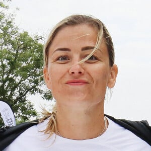 Laure Boulleau qui présente le nouveau maillot extérieur du PSG pour la saison 2023-2024 - Première édition des "10 km du Paris Saint-Germain" au Parc des Princes à Paris le 2 juillet 2023. La dernière de nombreuses initiatives hors-football du club de la capitale dont il peut, déjà, se targuer de la réussite : au total, ce sont plus de 12 000 participants qui ont pris le départ de ce parcours de 10 kilomètres, maillot noir floqué au nom de la course (« We run Paris ») sur les épaules.