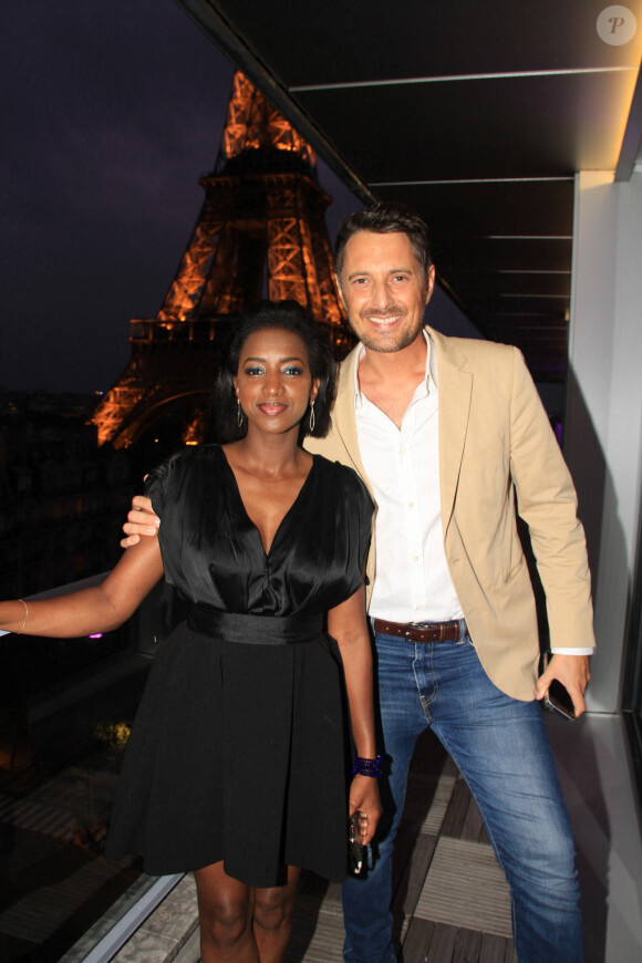 Exclusif - Hapsatou Sy et son mari Vincent Cerruti - Le Grand Dîner du 14 juillet, sur le rooftop de l'hôtel Pullman Tour Eiffel à Paris, France, le 14 juillet 2021. © Philippe Baldini/Bestimage