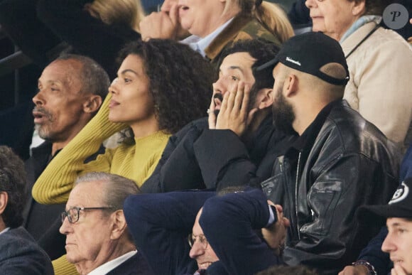 Tina Kunakey, BigFlo et Oli - Célébrités dans les tribunes de la demi-finale retour de Ligue des champions entre le PSG face au Borussia Dortmund (0-1) au Parc des Princes à Paris le 7 mai 2024. © Cyril Moreau/Bestimage