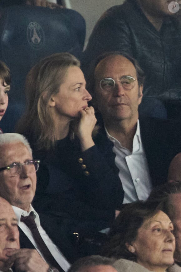 Xavier Niel et sa compagne Delphine Arnault - Célébrités dans les tribunes de la demi-finale retour de Ligue des champions entre le PSG face au Borussia Dortmund (0-1) au Parc des Princes à Paris le 7 mai 2024. © Cyril Moreau/Bestimage