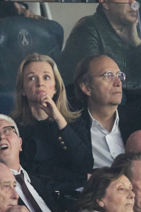 Xavier Niel et sa compagne Delphine Arnault - Célébrités dans les tribunes de la demi-finale retour de Ligue des champions entre le PSG face au Borussia Dortmund (0-1) au Parc des Princes à Paris le 7 mai 2024. © Cyril Moreau/Bestimage