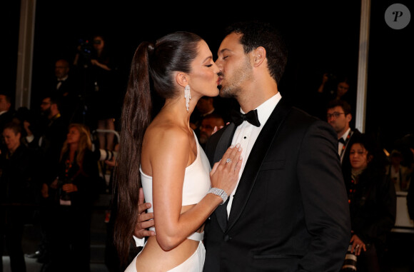 Iris Mittenaere et Diego El Glaoui - Montée des marches du film " Le retour (Homecoming) " lors du 76ème Festival International du Film de Cannes, au Palais des Festivals à Cannes. Le 17 mai 2023 © Jacovides-Moreau / Bestimage 