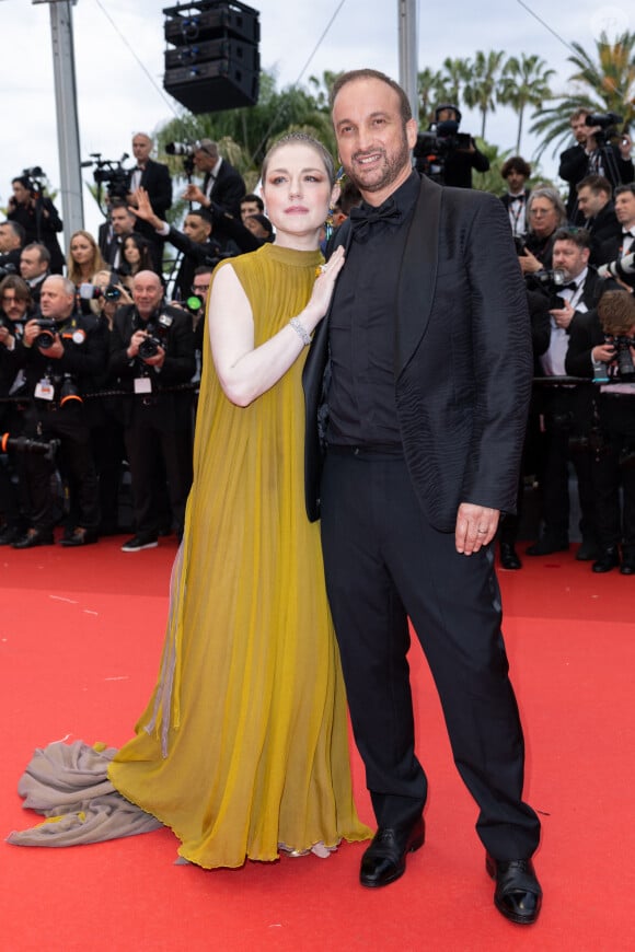 Emilie Dequenne was smiling this Tuesday.  Emilie Dequenne and her husband Michel Ferracci - Climbing the film steps " The second act " for the opening ceremony of the Cannes International Film Festival, at the Palais des Festivals in Cannes.  © Olivier Borde / Bestimage 