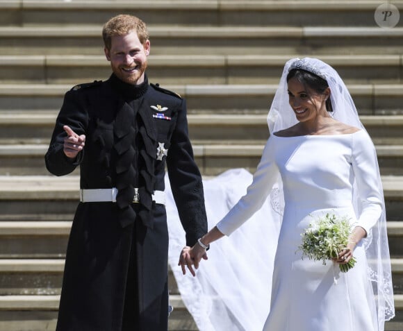 Un jour de fête que personne n'a oublié ! 
Le prince Harry, duc de Sussex, et Meghan Markle, duchesse de Sussex, à la sortie de chapelle St. George au château de Windsor - Sortie après la cérémonie de mariage du prince Harry et de Meghan Markle en la chapelle Saint-George au château de Windsor, Royaume Uni.