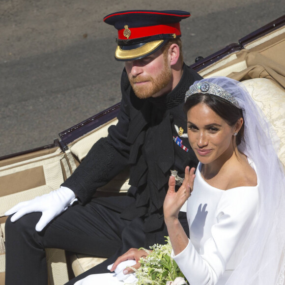 Le prince Harry, duc de Sussex, et Meghan Markle, duchesse de Sussex, en calèche au château de Windsor après la cérémonie de leur mariage au château de Windsor, Royaume Uni, le 19 mai 2018. 