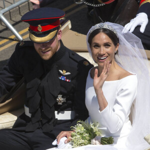 Le prince Harry, duc de Sussex, et Meghan Markle, duchesse de Sussex, en calèche au château de Windsor après la cérémonie de leur mariage au château de Windsor, Royaume Uni, le 19 mai 2018. 