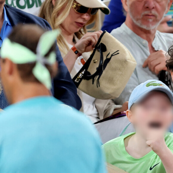 Le chanteur Raphael et son fils Aliocha dans les tribunes pour le premier tour des Internationaux de France de tennis de Roland Garros 2024 opposant R.Nadal (Rafa) à A.Zverev, à Paris, France, le 27 mai 2024. © Jacovides-Moreau/Bestimage