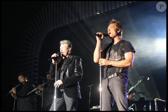 David Hallyday est revenu notamment sur leur collaboration pour l'album "Sang pour Sang"
EXCLUSIF : Johnny Hallyday et son fils David Hallyday en concert à Monaco lors du Tour 66