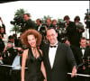 Ses six enfants sont issus de trois mariages différents. Ici, l'acteur pose avec Nathalie, sa deuxième épouse.
Nathalie Diskiewicz, Jean Reno - 48ème Festival International du Film à Cannes 1995 souriant smoking plein pied