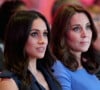 "La première version de la déclaration avait été beaucoup plus douce, mais William et Catherine avaient tous deux souhaité la durcir", apprend-t-on.
Meghan Markle et Catherine Kate Middleton (enceinte), duchesse de Cambridge lors du premier forum annuel de la Fondation Royale à Londres le 28 février 2018. 