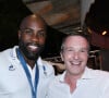 Ce jour-là, de nombreuses personnalités sont venues féliciter Teddy Riner
Exclusif - Teddy Riner et Stéphane Rotenberg - Teddy Riner fête son titre de champion Olympique de judo +100KG au restaurant "Podium" du groupe (Les bistrots Pas Parisiens) à Paris le 2 aout 2024. © Rachid Bellak/Bestimage