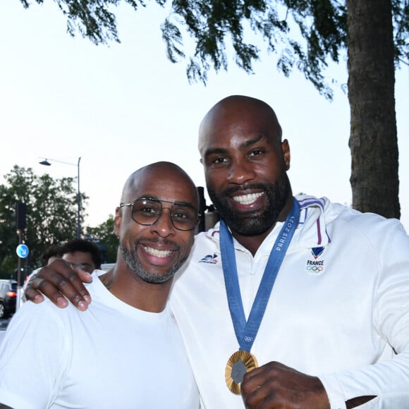 Exclusif - Teddy Riner et Franck Nema, le directeur du groupe (Les bistrots Pas Parisiens) - Teddy Riner fête son titre de champion Olympique de judo +100KG au restaurant "Podium" du groupe (Les bistrots Pas Parisiens) à Paris le 2 aout 2024. © Rachid Bellak/Bestimage