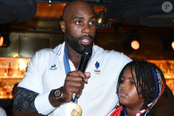 Exclusif - Teddy Riner et son fils Eden - Teddy Riner fête son titre de champion Olympique de judo +100KG au restaurant "Podium" du groupe (Les bistrots Pas Parisiens) à Paris le 2 aout 2024. © Rachid Bellak/Bestimage