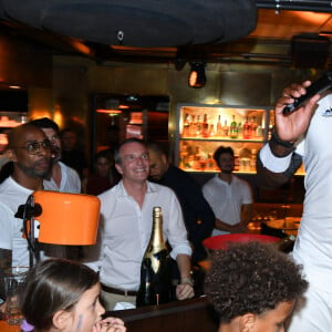 Exclusif -  Teddy Riner et son fils Eden - Teddy Riner fête son titre de champion Olympique de judo +100KG au restaurant "Podium" du groupe (Les bistrots Pas Parisiens) à Paris le 2 aout 2024. © Rachid Bellak/Bestimage