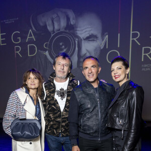 Exclusif - Jean-Luc Reichmann et sa femme Nathalie Lecoultre, Nikos Aliagas et sa femme Tina Grigoriou - Vernissage de l'exposition photographique de Nikos Aliagas "Regards Miroirs" à la Seine Musicale à Boulogne-Billancourt le 14 avril 2022. © Cyril Moreau/Bestimage 