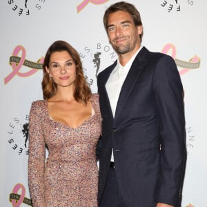 Camille Lacourt et sa compagne Alice Detollenaere (Miss Bourgogne 2010) - Photocall du 4ème gala de charité de l'association "Les Bonnes Fées" à l'occasion de la campagne mondiale "Octobre Rose" à l'hôtel Peninsula, Paris le 5 octobre 2023. © Coadic Guirec/Bestimage