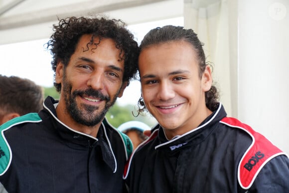 Exclusif - Tomer Sisley et son beau fils Dino Zeitoun-Sisley - lors du marathon Karting Jules Bianchi au circuit Paul Ricard au Castellet le 8 septembre 2024. La course : Unique au monde une course de 42 heures 19 minutes et 50 secondes en karting, en auto et en moto. © Anne-Sophie Guebey via Bestimage 