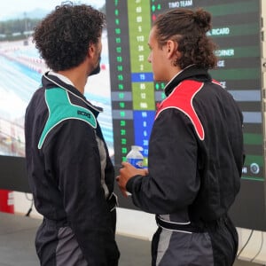 Exclusif - Tomer Sisley et son beau-fils Dino Zeitoun-Sisley lors du marathon Karting Jules Bianchi au circuit Paul Ricard au Castellet le 8 septembre 2024. © Anne-Sophie Guebey via Bestimage 