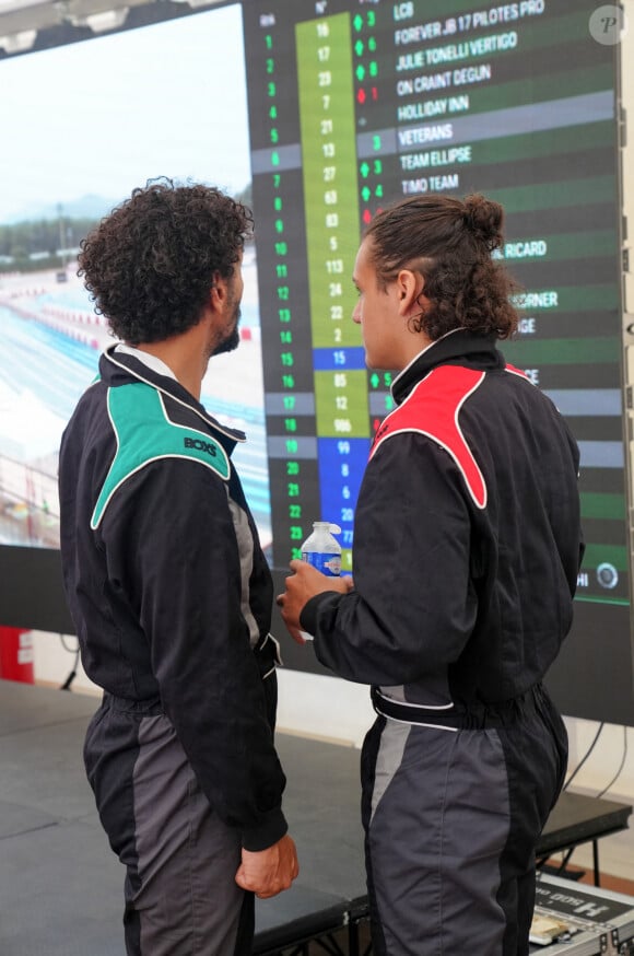 Exclusif - Tomer Sisley et son beau-fils Dino Zeitoun-Sisley lors du marathon Karting Jules Bianchi au circuit Paul Ricard au Castellet le 8 septembre 2024. © Anne-Sophie Guebey via Bestimage 