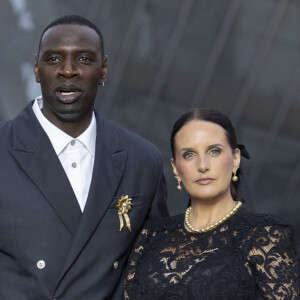 Omar Sy, star internationale du cinéma, est connu notamment pour ses rôles dans "Intouchables" et "Lupin" 
Omar Sy et sa Helene (bijoux Tasaki) - Photocall du dîner "Prelude pour les JO" à la Fondation Vuitton à Paris, France, le 25 juillet 2024. © Olivier Borde/Bestimage 