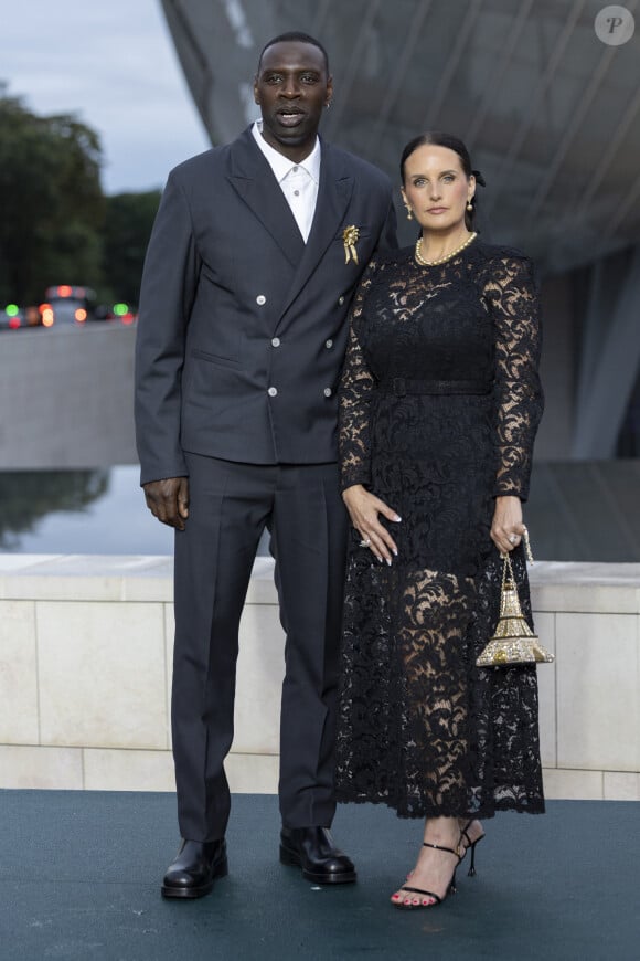 Omar Sy, star internationale du cinéma, est connu notamment pour ses rôles dans "Intouchables" et "Lupin" 
Omar Sy et sa Helene (bijoux Tasaki) - Photocall du dîner "Prelude pour les JO" à la Fondation Vuitton à Paris, France, le 25 juillet 2024. © Olivier Borde/Bestimage 