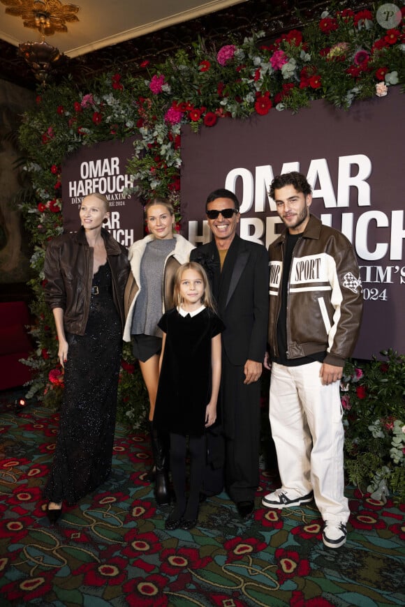 Omar Harfouch, sa femme Yulia Lobova et leur fille Gustavia avec Simon Castaldi et sa compagne Cassandra Jullia au photocall de la soirée Omar Harfouch "Dîner chez Maxim's" à Paris le 9 octobre 2024. Le dîner organisé par O.Harfouch était pour remercier les célébrités venues à son magnifique concert “Concerto pour la paix”, au théâtre des Champs Elysées le 18 septembre 2024. O.Harfouch va partir pour une tournée mondiale du Concerto qui comprend le Vatican, l’Opéra de Dubaï et New York . © Perusseau / Tribeca / Bestimage  Photocall of the Omar Harfouch ‘Dîner chez Maxim's’ evening in Paris on 9 October 2024.