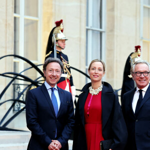 Stéphane Bern, Adelaïde de Clermont-Tonnerre et le designer Edouard Vermeulen arrivant au dîner d'état au palais de l'Elysée à Paris en l'honneur de la visite du roi et de la reine de Belgique en France le 14 octobre 2024. © Dominique Jacovides / Bestimage 