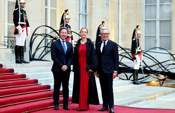 Stéphane Bern, Adelaïde de Clermont-Tonnerre et le designer Edouard Vermeulen arrivant au dîner d'état au palais de l'Elysée à Paris en l'honneur de la visite du roi et de la reine de Belgique en France le 14 octobre 2024. © Dominique Jacovides / Bestimage 