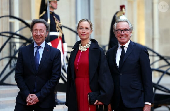 Stéphane Bern, Adelaïde de Clermont-Tonnerre et le designer Edouard Vermeulen arrivant au dîner d'état au palais de l'Elysée à Paris en l'honneur de la visite du roi et de la reine de Belgique en France le 14 octobre 2024. © Dominique Jacovides / Bestimage  Celebs Arrivals at the state dinner at the Elysée Palace in Paris in honour of the visit of the King and Queen of Belgium to France on october 14th 2024 