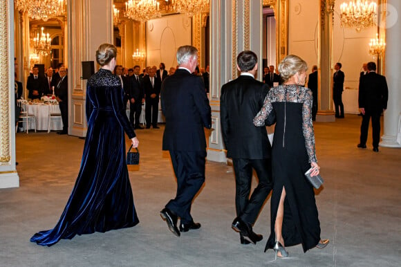 Le président Emmanuel Macron, Brigitte Macron, le roi Philippe et la reine Mathilde de Belgique lors du dîner d'état au palais de l'Elysée à Paris en l'honneur du couple royal de Belgique, en visite d'état à Paris le 14 octobre 2024. © Frédéric Andrieu / Bestimage 