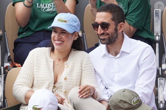  Le père de trois garçons nés de ses amours avec son épouse Souailla détaille alors ce qu'il en est. 
Jimmy Mohamed et sa femme Souailla - Célébrités dans les tribunes des Internationaux de France de tennis de Roland Garros 2024 à Paris le 26 mai 2024. © Moreau-Jacovides/Bestimage